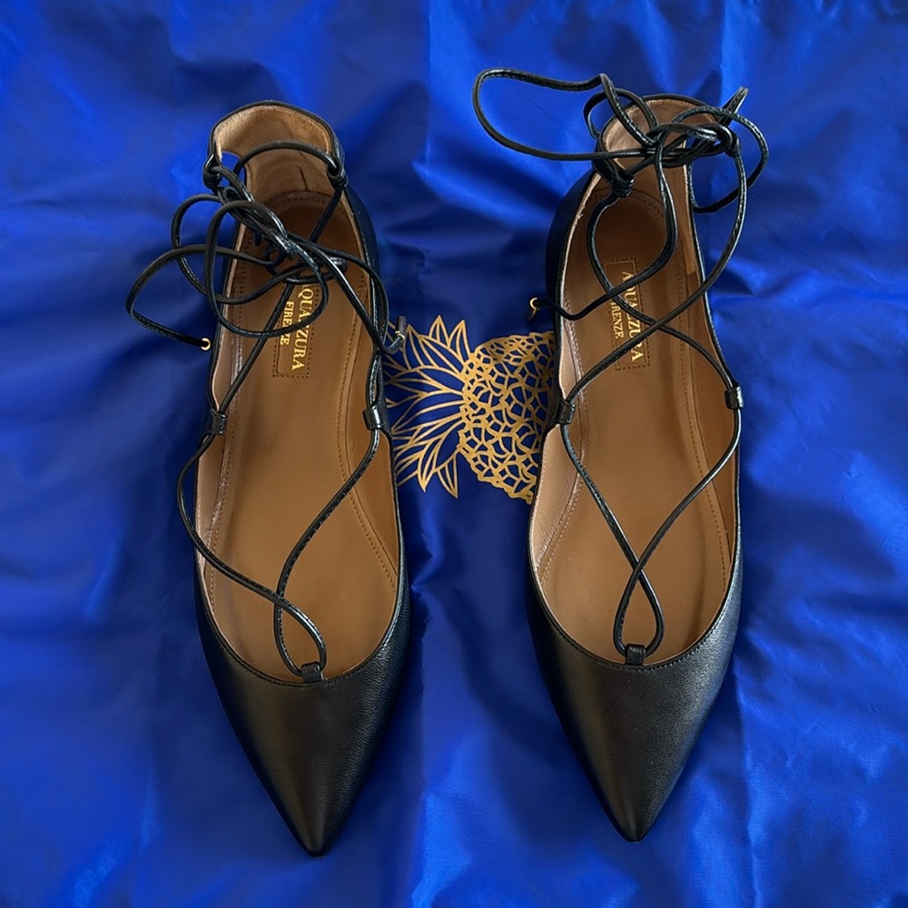 Aquazzura Christy Flats in nappa leather color black.
